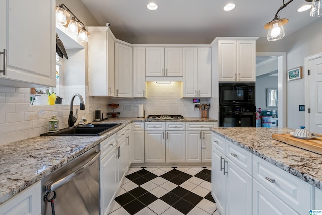 1051 Oak Meadows Rd, Birmingham, AL 35242 - kitchen with black appliances, a sink, white cabinets, tasteful backsplash, and light stone countertops