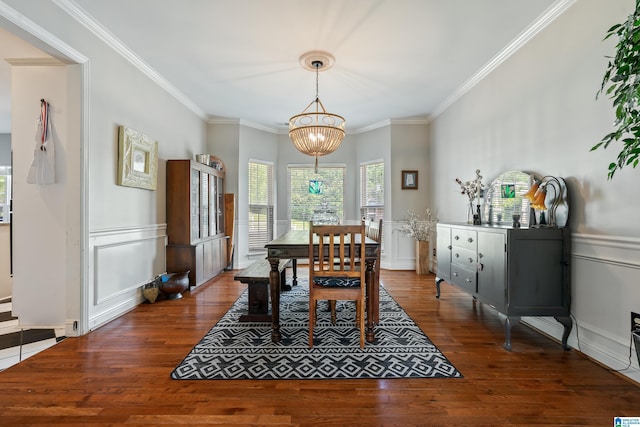 1051 Oak Meadows Rd, Birmingham, AL 35242 - dining space featuring crown molding, wood finished floors, a chandelier, a decorative wall, and a wainscoted wall