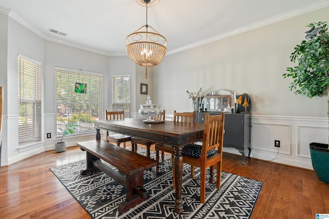 1051 Oak Meadows Rd, Birmingham, AL 35242 - dining space featuring a chandelier, wood finished floors, and crown molding