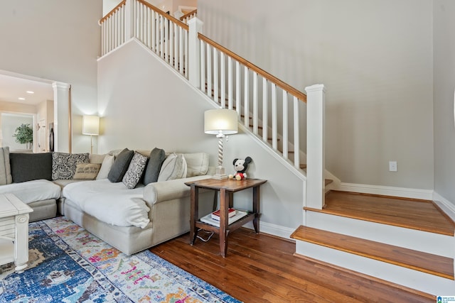 1051 Oak Meadows Rd, Birmingham, AL 35242 - living area with wood finished floors, stairway, baseboards, and a high ceiling