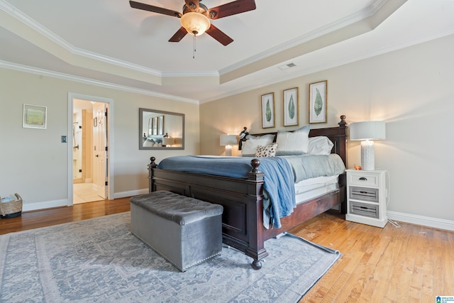1051 Oak Meadows Rd, Birmingham, AL 35242 - bedroom featuring a raised ceiling, light wood-type flooring, crown molding, baseboards, and ceiling fan