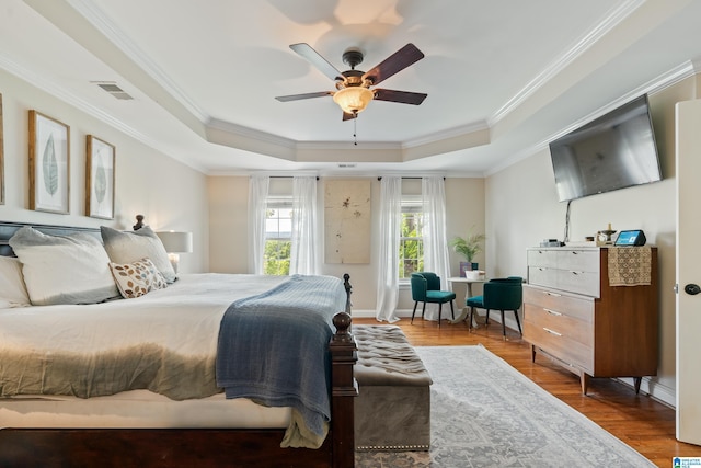 1051 Oak Meadows Rd, Birmingham, AL 35242 - bedroom with a raised ceiling, wood finished floors, crown molding, and ceiling fan