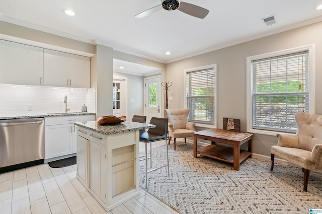 1051 Oak Meadows Rd, Birmingham, AL 35242 - kitchen with dishwasher, ceiling fan, ornamental molding, decorative backsplash, and light stone countertops