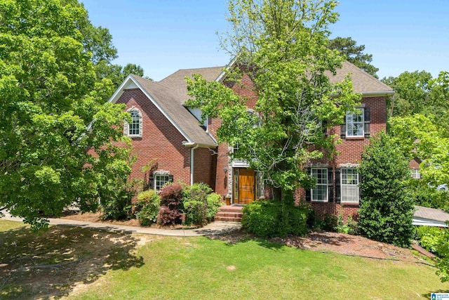 1051 Oak Meadows Rd, Birmingham, AL 35242 - view of front of house featuring brick siding, a front lawn, and roof with shingles