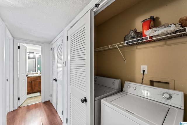 505 Patton Chapel Way Unit 505, Hoover, AL 35226 - laundry area featuring separate washer and dryer, wood finished floors, and a textured ceiling