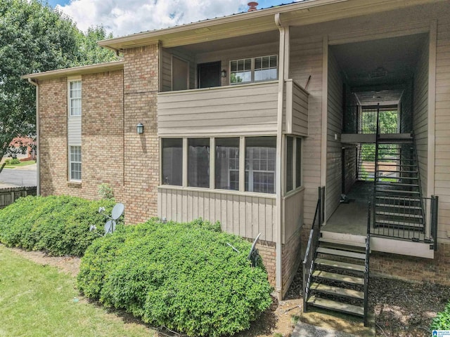 505 Patton Chapel Way Unit 505, Hoover, AL 35226 - view of property exterior featuring board and batten siding and brick siding
