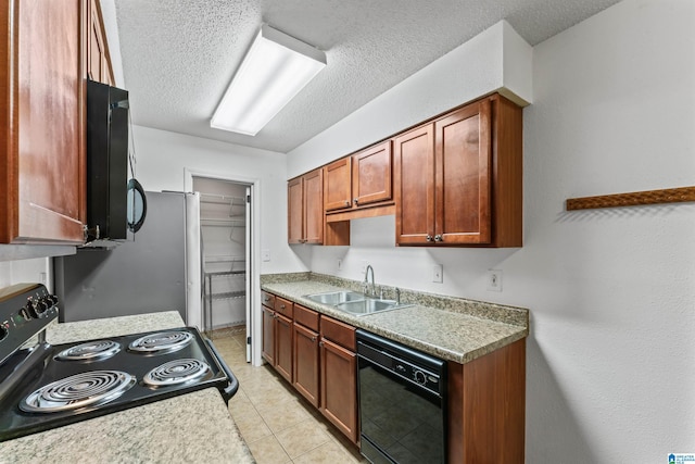 505 Patton Chapel Way Unit 505, Hoover, AL 35226 - kitchen with a sink, black appliances, a textured ceiling, light countertops, and light tile patterned flooring