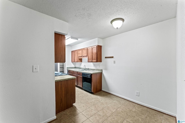 505 Patton Chapel Way Unit 505, Hoover, AL 35226 - kitchen with black dishwasher, baseboards, brown cabinets, a textured ceiling, and light countertops