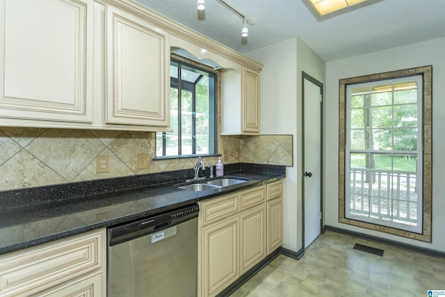4734 Chablis Way, Birmingham, AL 35244 - kitchen with cream cabinets, stainless steel dishwasher, a sink, tasteful backsplash, and dark stone countertops