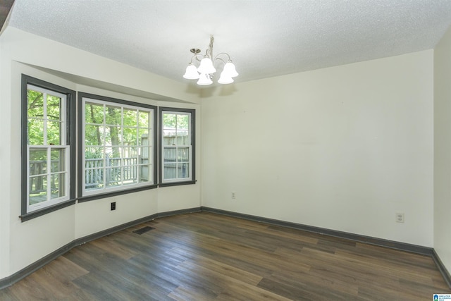 4734 Chablis Way, Birmingham, AL 35244 - unfurnished room featuring a chandelier, wood finished floors, a textured ceiling, and baseboards
