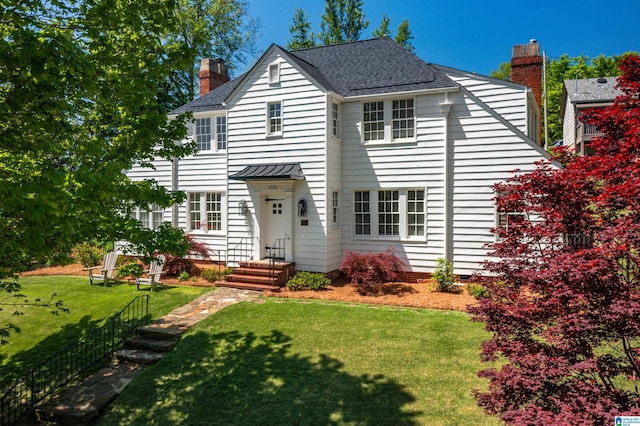 2520 Lanark Rd, Birmingham, AL 35223 - view of front of home with a chimney, a front yard, and roof with shingles