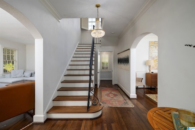 2520 Lanark Rd, Birmingham, AL 35223 - stairs with arched walkways, healthy amount of natural light, crown molding, wood finished floors, and baseboards