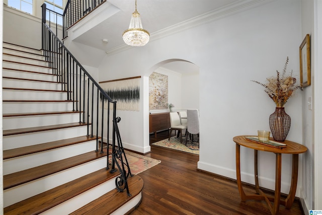 2520 Lanark Rd, Birmingham, AL 35223 - entrance foyer featuring arched walkways, baseboards, wood finished floors, stairs, and a chandelier