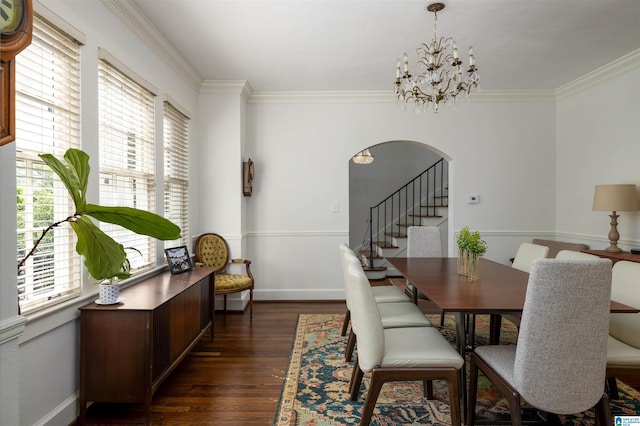 2520 Lanark Rd, Birmingham, AL 35223 - dining room with arched walkways, healthy amount of natural light, dark wood finished floors, a chandelier, and crown molding