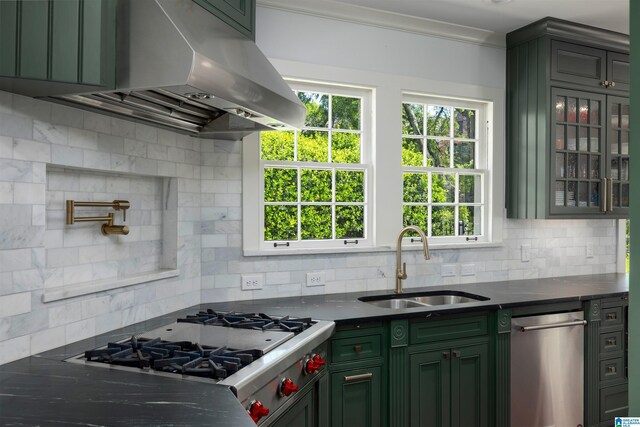 2520 Lanark Rd, Birmingham, AL 35223 - kitchen with green cabinetry, a sink, under cabinet range hood, dishwasher, and decorative backsplash