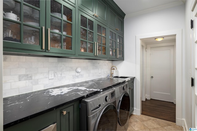 2520 Lanark Rd, Birmingham, AL 35223 - laundry room with cabinet space, independent washer and dryer, crown molding, light tile patterned floors, and baseboards