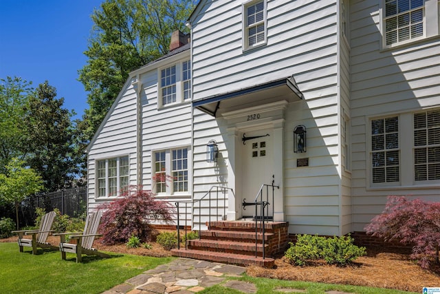 2520 Lanark Rd, Birmingham, AL 35223 - doorway to property featuring fence and a chimney