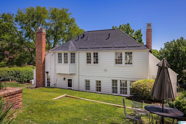 2520 Lanark Rd, Birmingham, AL 35223 - back of property featuring a chimney and a lawn