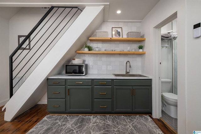 2520 Lanark Rd, Birmingham, AL 35223 - indoor wet bar featuring stainless steel microwave, dark wood-type flooring, tasteful backsplash, stairway, and recessed lighting