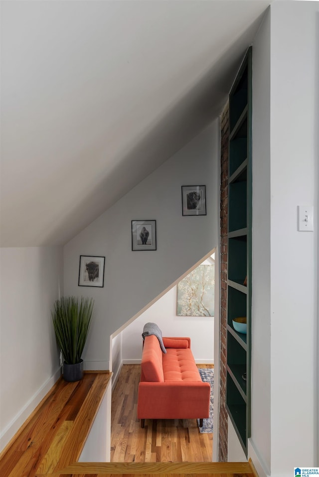 2520 Lanark Rd, Birmingham, AL 35223 - sitting room featuring lofted ceiling, wood finished floors, and baseboards