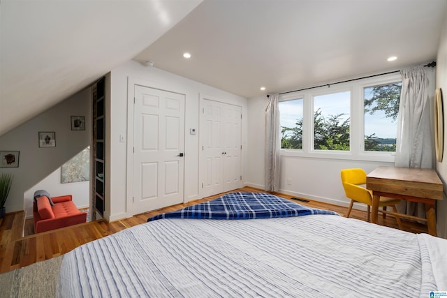 2520 Lanark Rd, Birmingham, AL 35223 - bedroom featuring wood finished floors, lofted ceiling, baseboards, and recessed lighting