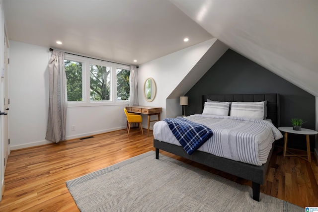 2520 Lanark Rd, Birmingham, AL 35223 - bedroom with wood finished floors, vaulted ceiling, recessed lighting, and baseboards