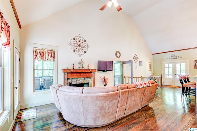 living room featuring high vaulted ceiling, a fireplace, wood finished floors, and a ceiling fan
