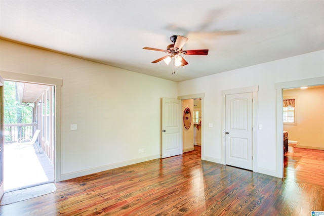 unfurnished bedroom featuring access to outside, wood finished floors, baseboards, and a ceiling fan
