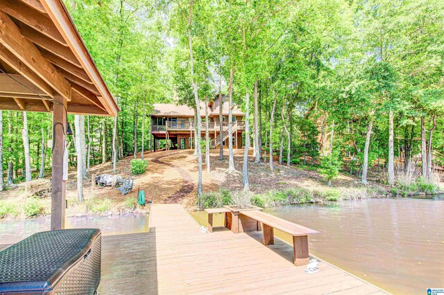 dock area with a water view and stairway