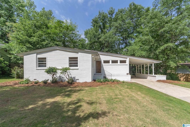 664 Bourbon Cir, Birmingham, AL 35213 - view of front of property featuring brick siding, driveway, a front lawn, crawl space, and an attached carport