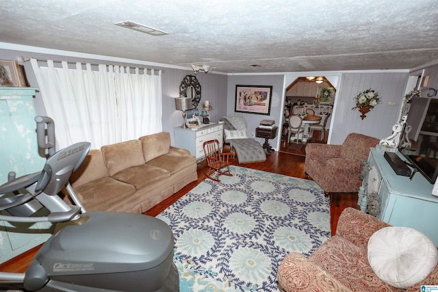 1619 Websters Chapel Rd, Wellington, AL 36279 - living room with wood finished floors, a textured ceiling, and ornamental molding