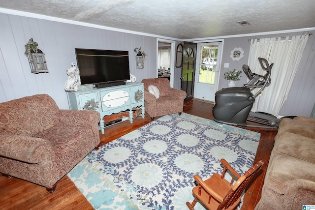 1619 Websters Chapel Rd, Wellington, AL 36279 - living area featuring wood finished floors, ornamental molding, and a textured ceiling
