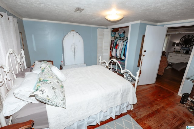 1619 Websters Chapel Rd, Wellington, AL 36279 - bedroom with wood finished floors, a textured ceiling, and ornamental molding