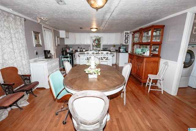 1619 Websters Chapel Rd, Wellington, AL 36279 - dining room with light wood-type flooring, a textured ceiling, and wainscoting