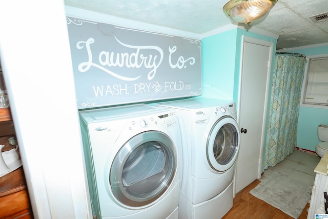 1619 Websters Chapel Rd, Wellington, AL 36279 - clothes washing area with washer and clothes dryer and light wood-type flooring