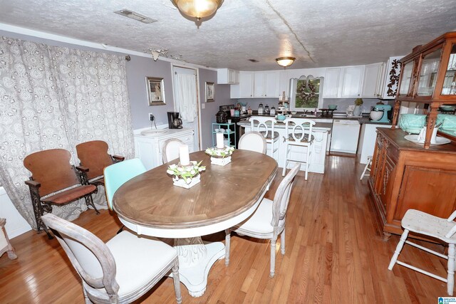 1619 Websters Chapel Rd, Wellington, AL 36279 - dining area with light wood-type flooring and a textured ceiling