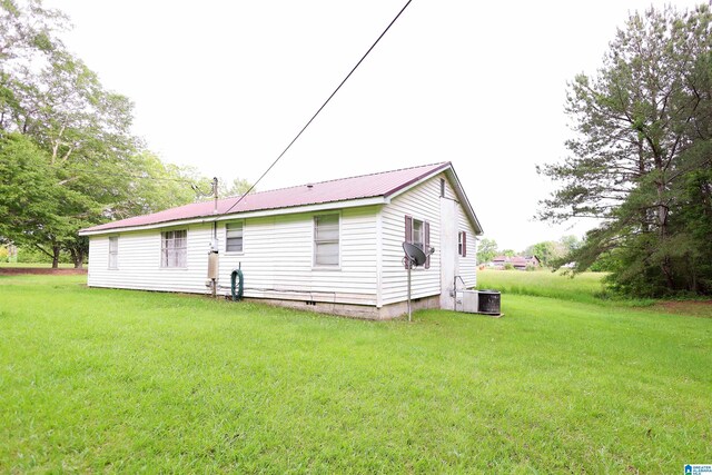 1619 Websters Chapel Rd, Wellington, AL 36279 - back of property featuring cooling unit, a lawn, and metal roof