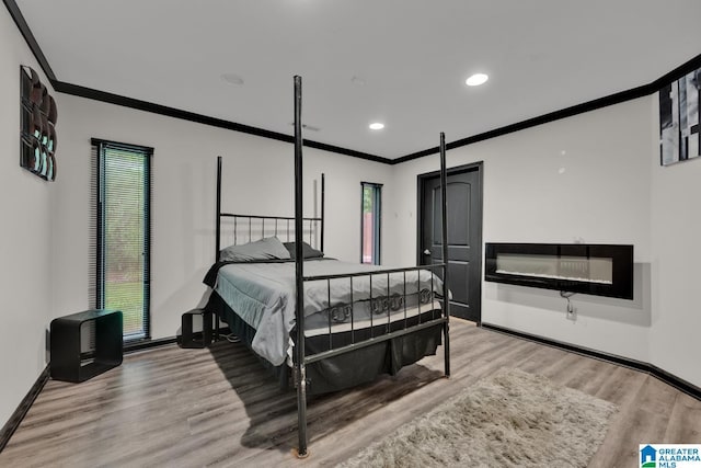 4150 County Highway 13, Locust Fork, AL 35097 - bedroom with ornamental molding, wood finished floors, baseboards, and recessed lighting