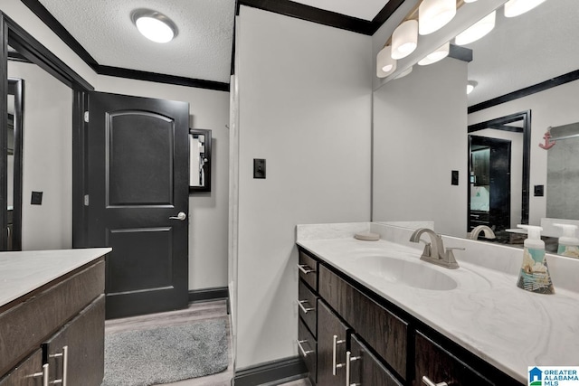 4150 County Highway 13, Locust Fork, AL 35097 - bathroom featuring a textured ceiling, vanity, and wood finished floors
