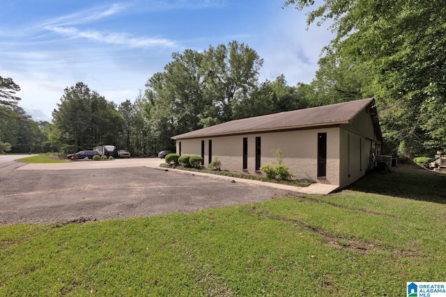 4150 County Highway 13, Locust Fork, AL 35097 - view of side of home featuring a yard and brick siding