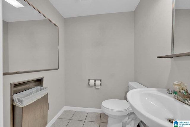 4150 County Highway 13, Locust Fork, AL 35097 - bathroom with a sink, toilet, baseboards, and tile patterned flooring