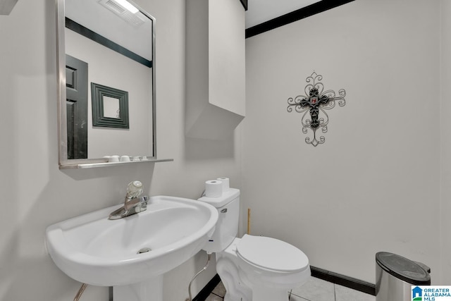 4150 County Highway 13, Locust Fork, AL 35097 - half bath featuring a sink, tile patterned floors, and toilet