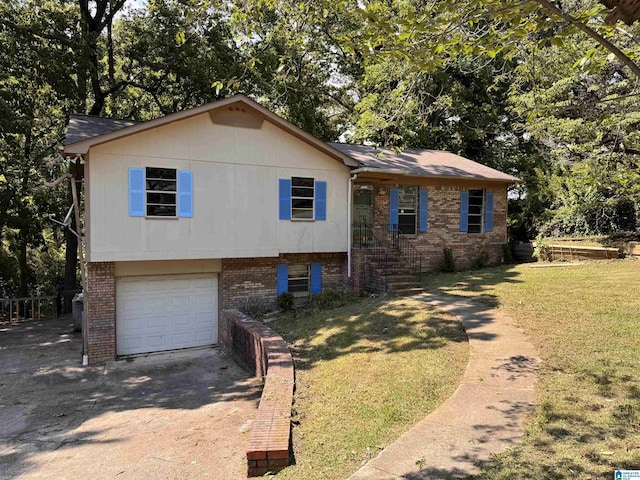 tri-level home with concrete driveway, a garage, brick siding, a front lawn, and view of scattered trees