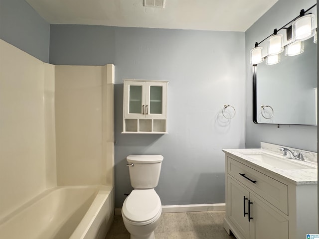 full bathroom with baseboards, vanity, and toilet