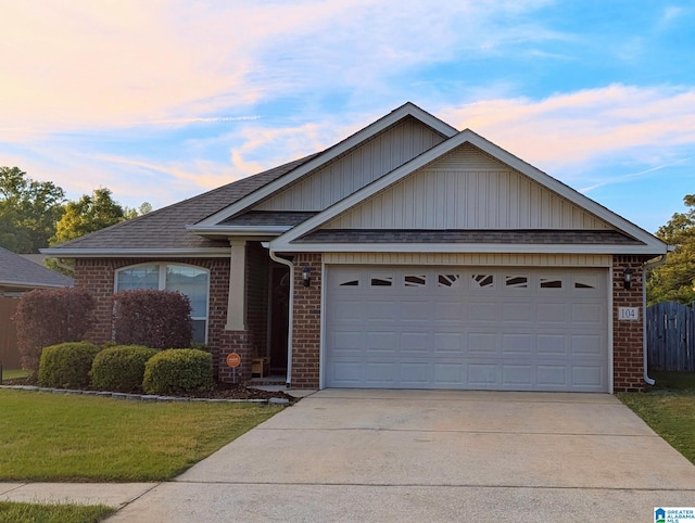 104 Southfield Dr, Alabaster, AL 35007 - view of front of house featuring brick siding, concrete driveway, a garage, a front yard, and a shingled roof