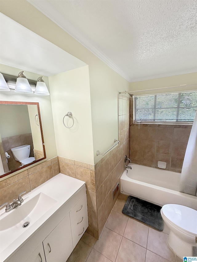 bathroom with tile walls, toilet, tile patterned flooring, crown molding, and a textured ceiling