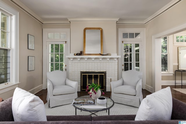 1479 Milner Cres S, Birmingham, AL 35205 - living room with wood finished floors, baseboards, a brick fireplace, and crown molding