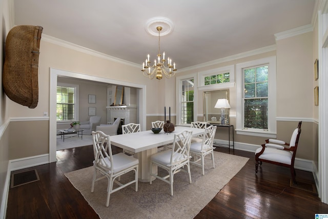 1479 Milner Cres S, Birmingham, AL 35205 - dining area featuring a chandelier, dark wood-style floors, ornamental molding, and baseboards
