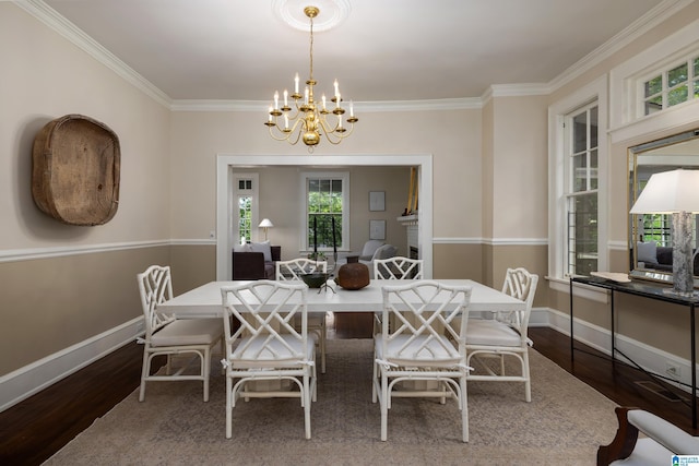 1479 Milner Cres S, Birmingham, AL 35205 - dining area featuring dark wood-style flooring, a chandelier, ornamental molding, and baseboards