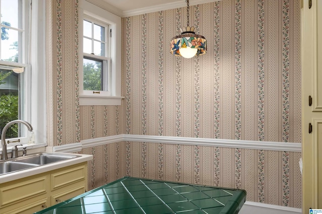 1479 Milner Cres S, Birmingham, AL 35205 - kitchen featuring a sink, wallpapered walls, cream cabinets, and crown molding